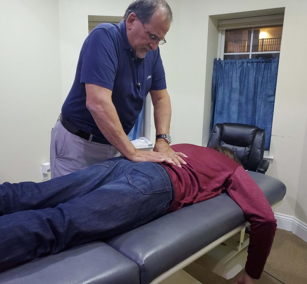 dr jeff adjusting a patient